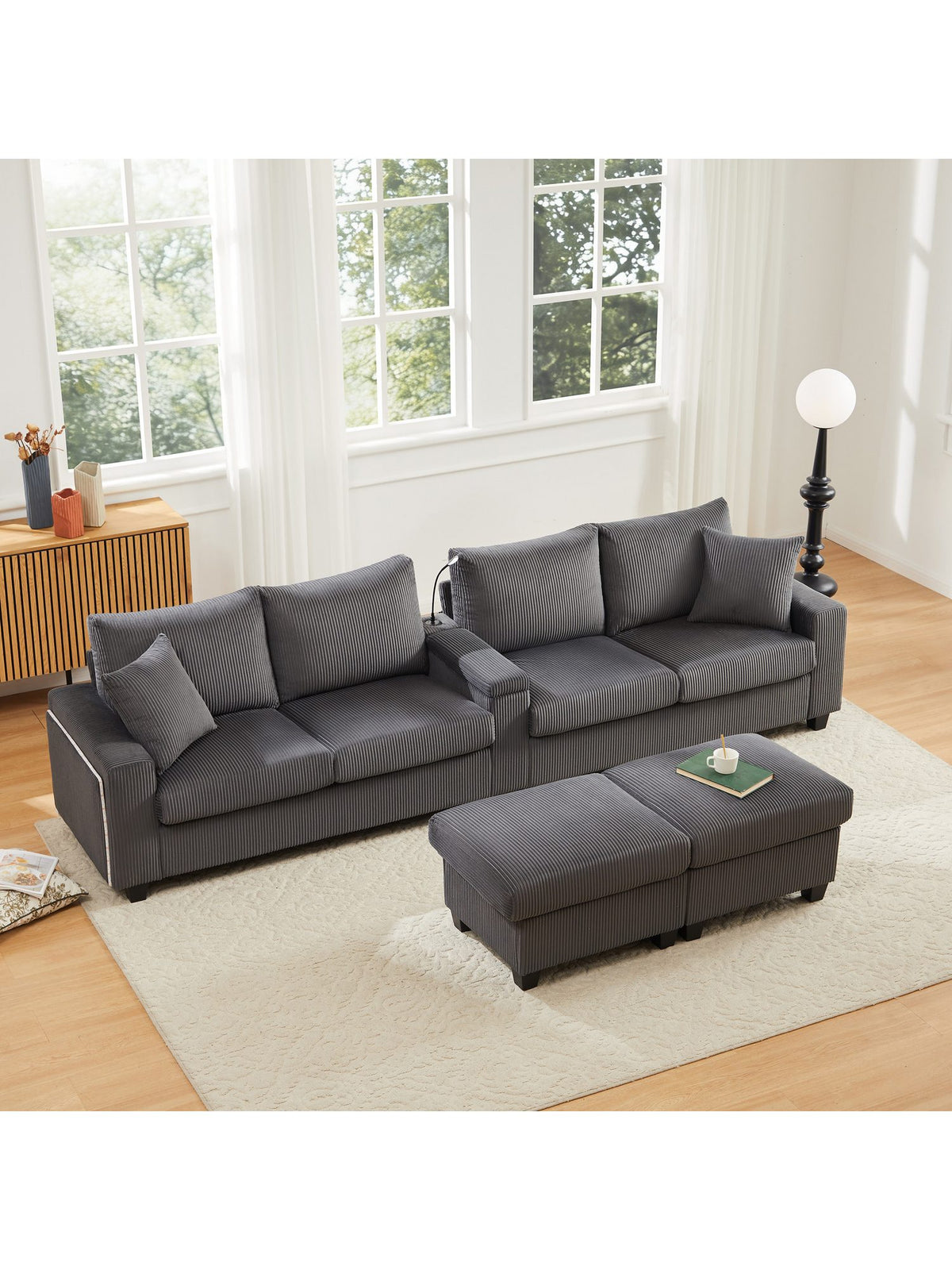 Seitenansicht des grauen Cord Sofas mit Armlehne