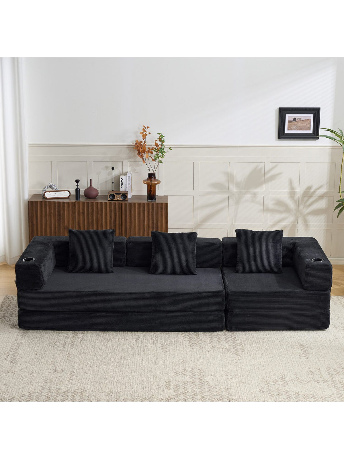 Cord Schlafsofa in Schwarz seitlich fotografiert