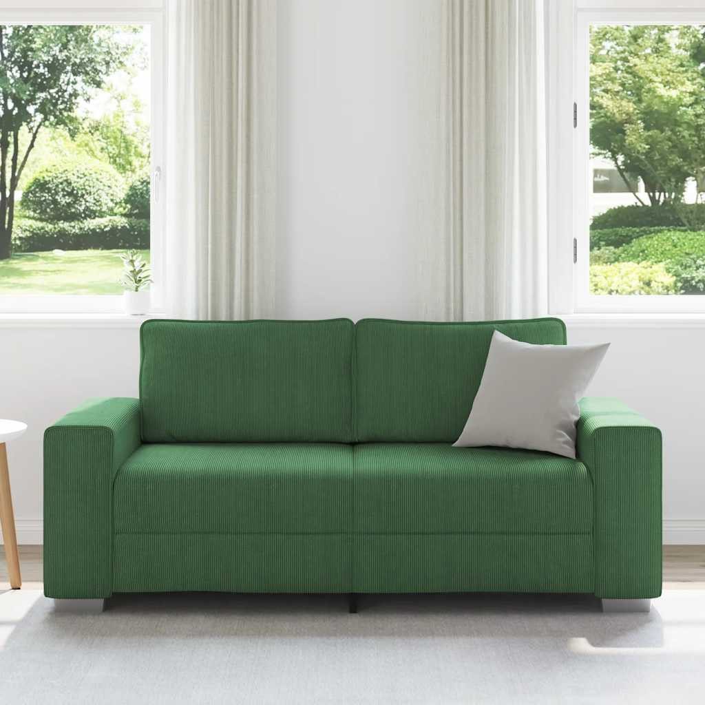 Cord Zweisitzer mit Rückenkissen im Wohnzimmer