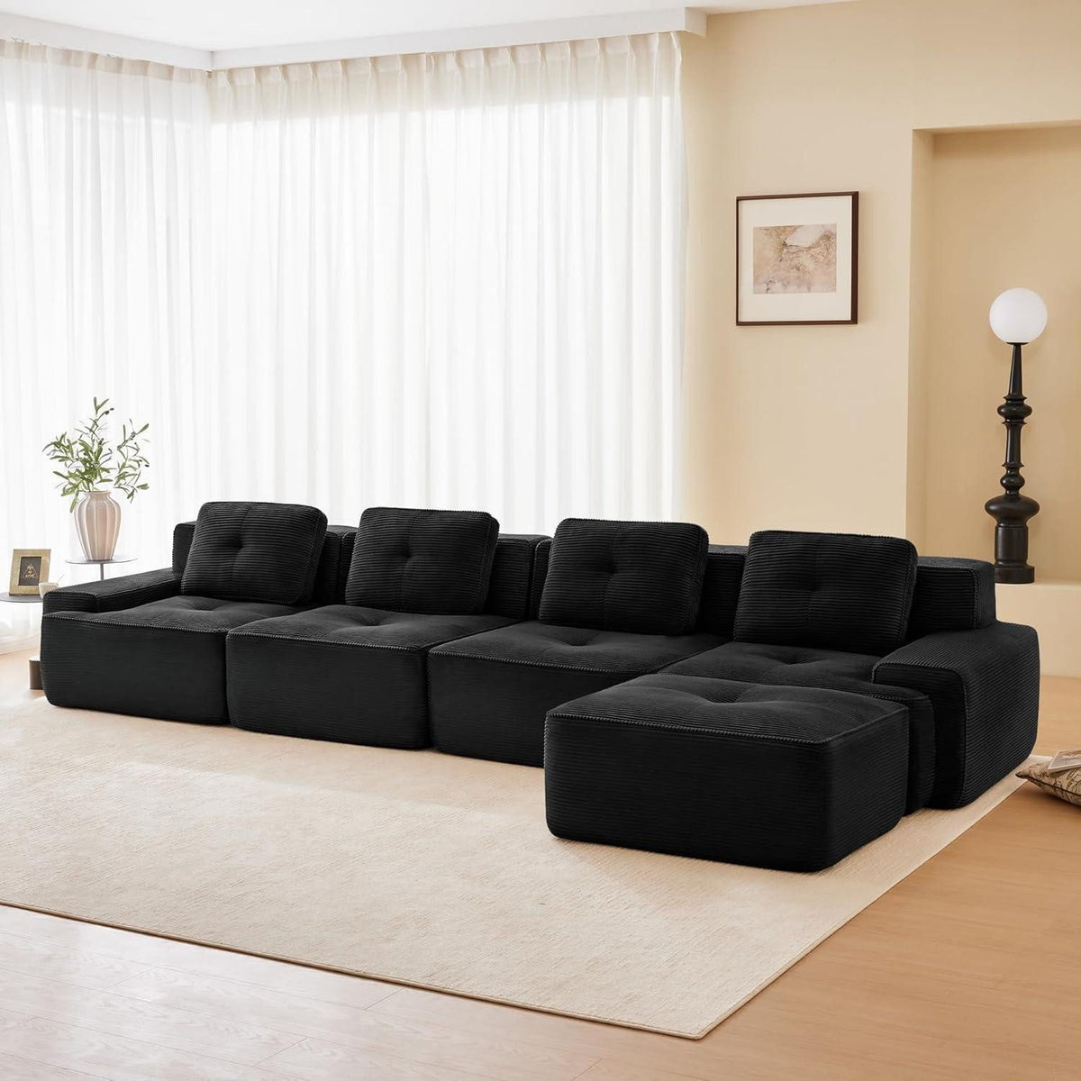 Module des schwarzen Cord Ecksofas neu angeordnet