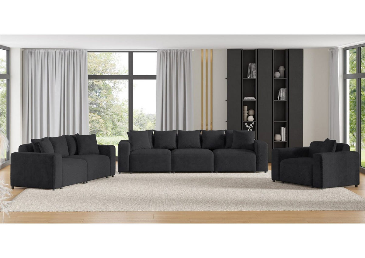 Detail der Cordrippen und Zierkissen des Sofas FUN AROA