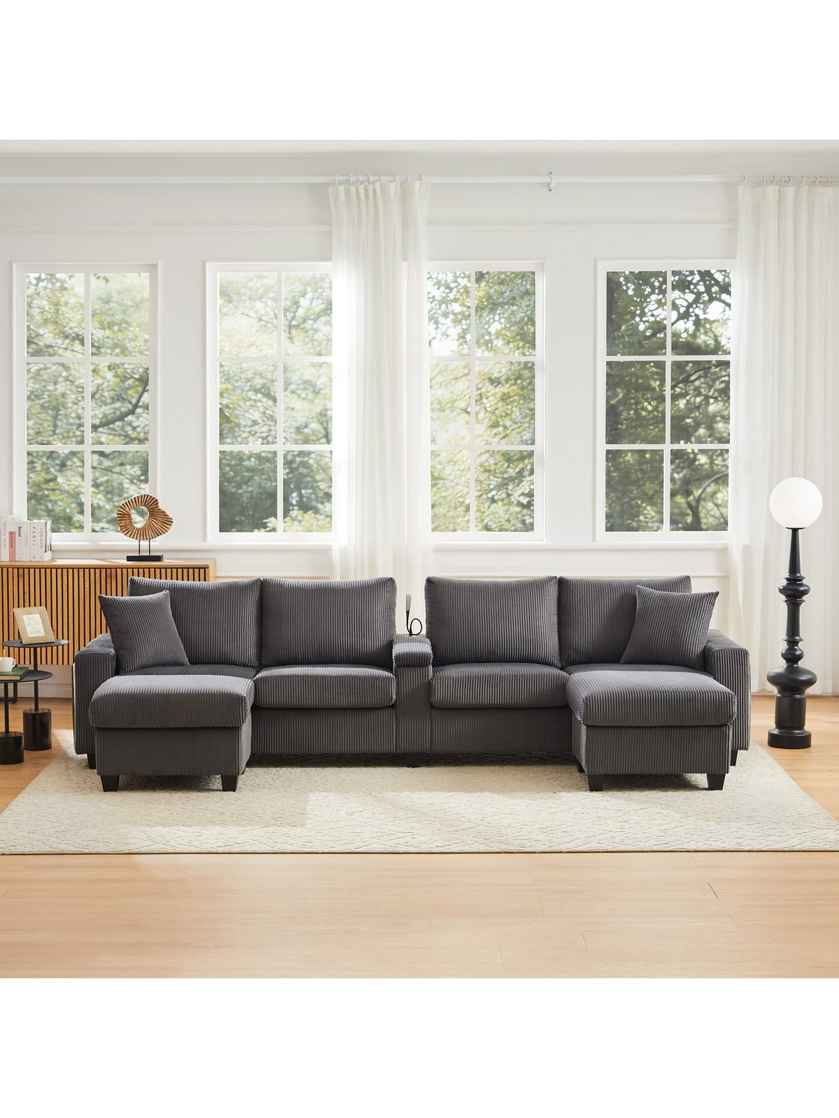 Graues Cord Sofa in U-Form von vorne fotografiert
