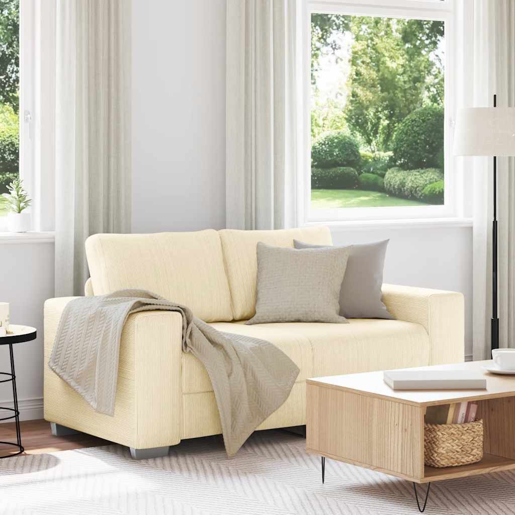 Cremefarbenes Cord Sofa seitlich fotografiert