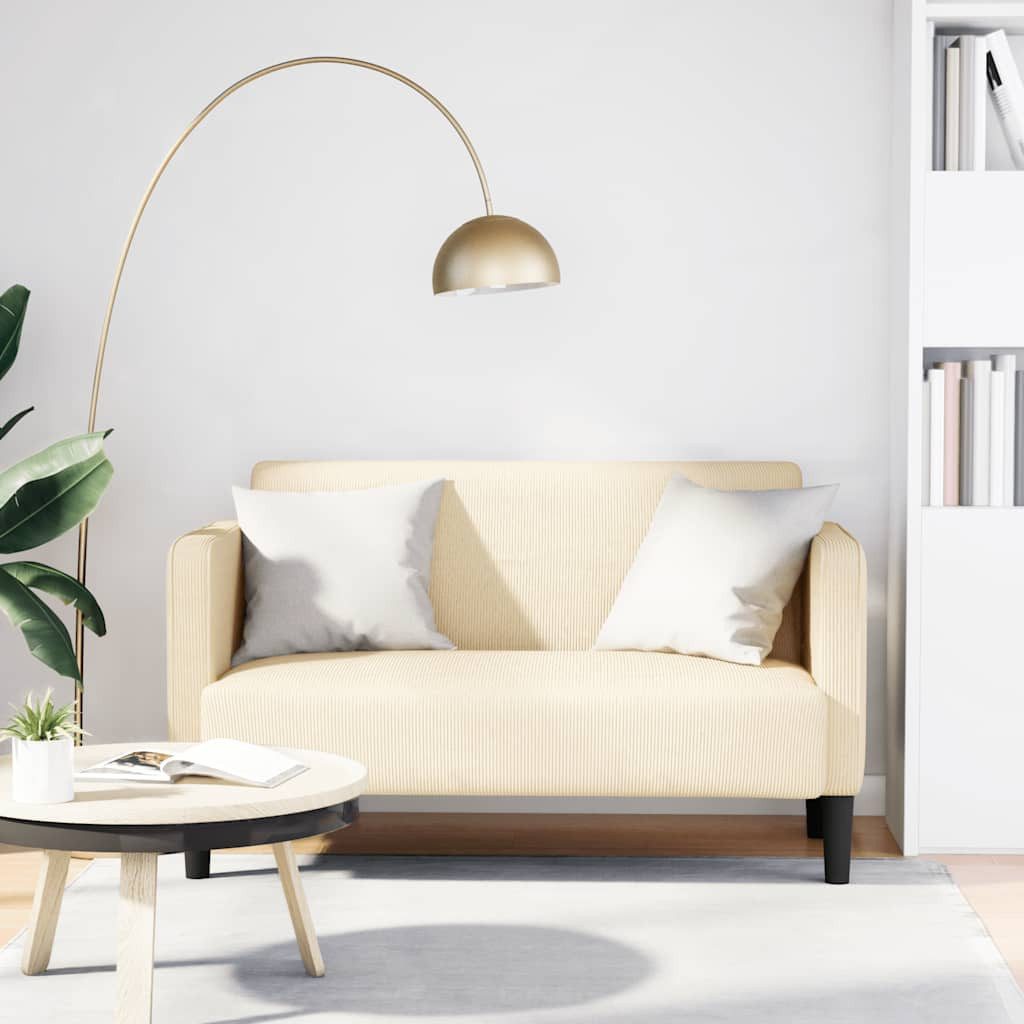 Cremefarbenes Cord Sofa seitlich fotografiert