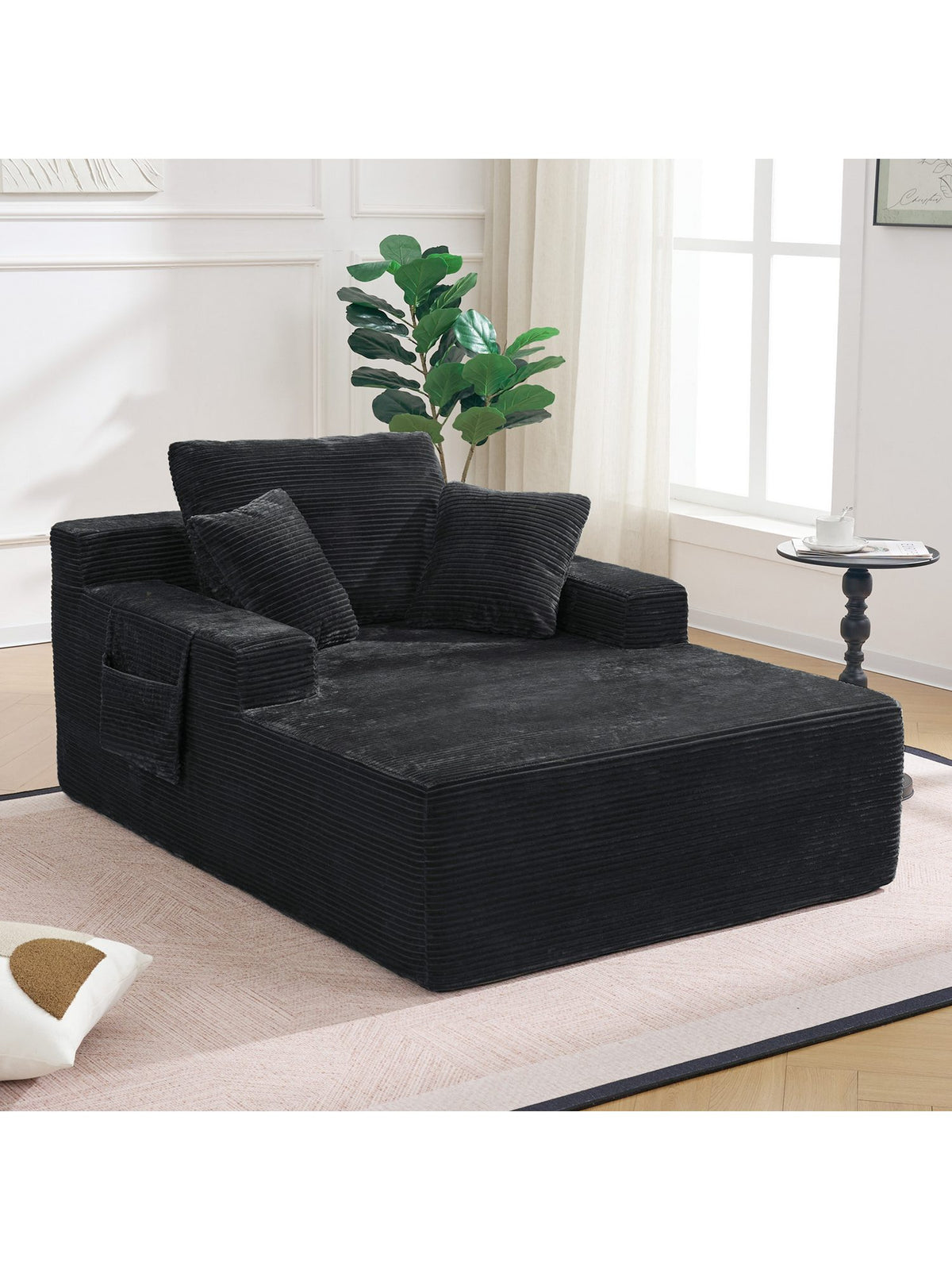 Seitentasche an der Armlehne des Cord Sofas CELYA