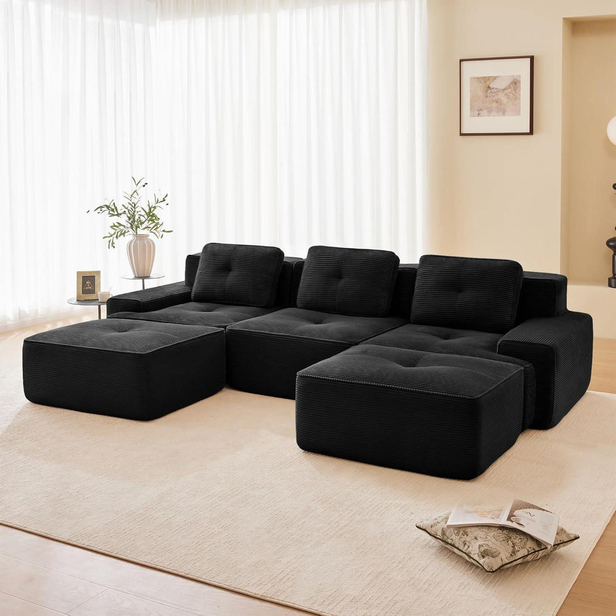 Module des schwarzen Cord Sofas in U-Form angeordnet