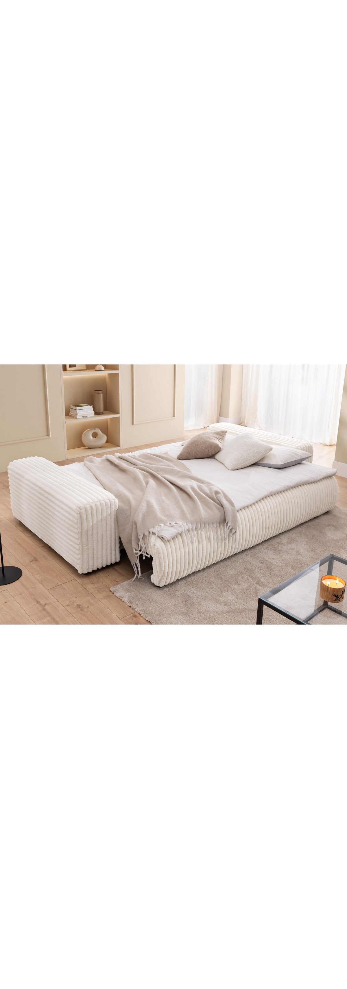 Schlafsofa MOLLIS mit Zierkissen im Wohnzimmer