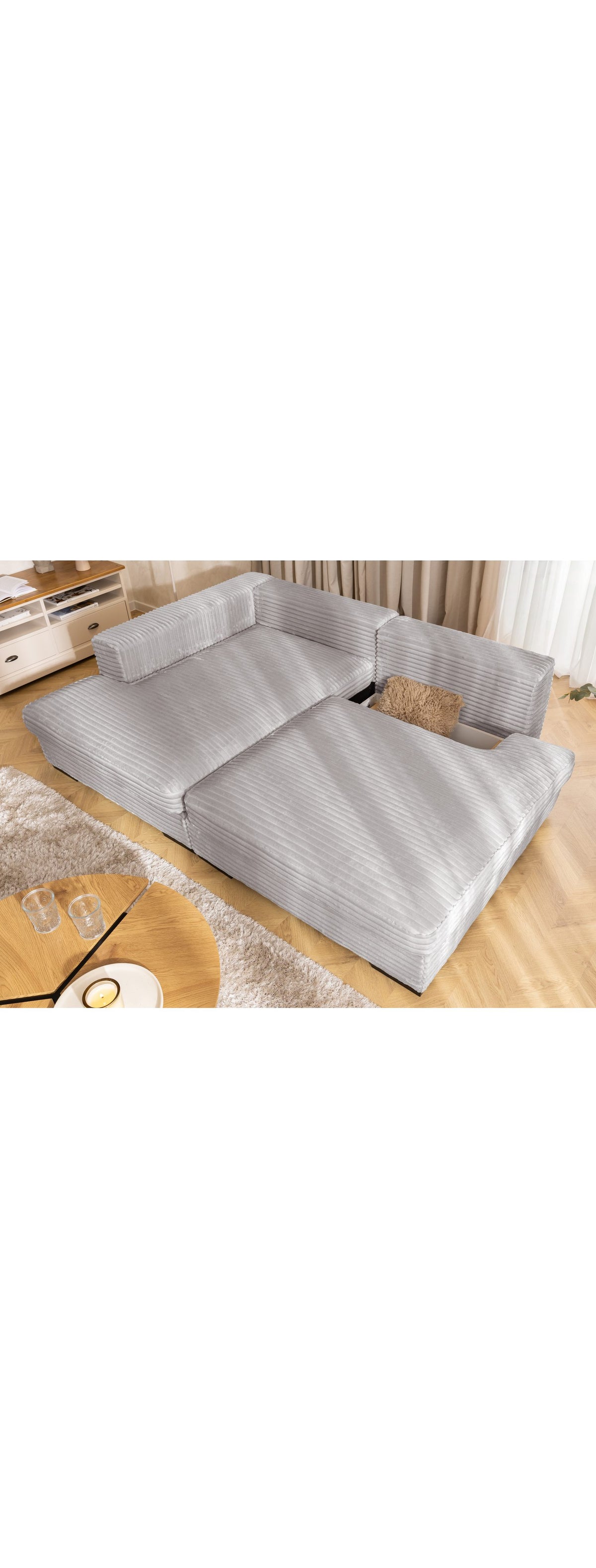 Bettkasten des Cord Ecksofas WOLKE geoeffnet
