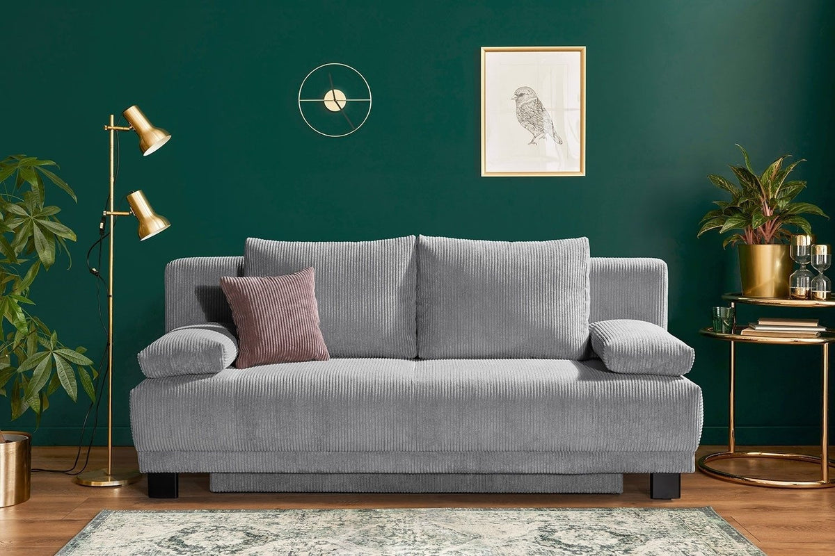 Cord Schlafsofa JUNA mit Kissen im Wohnzimmer
