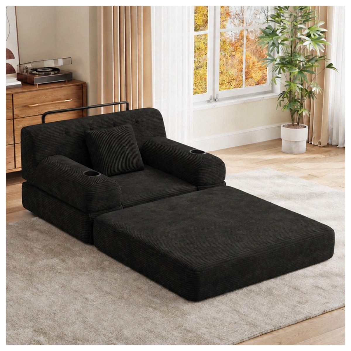 Schwarzes Schlafsofa aus Cord im Wohnraum