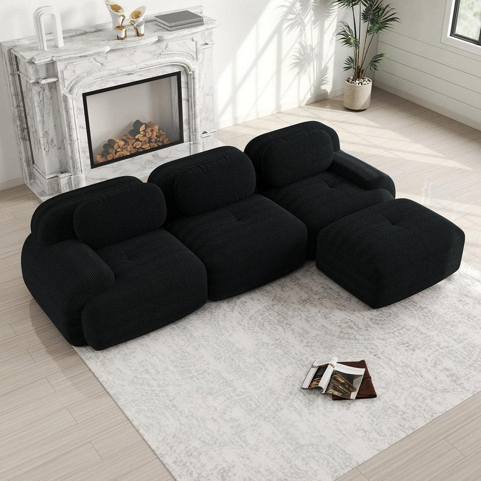 Modulare Cord Wohnlandschaft in Schwarz mit Ottomane von vorne