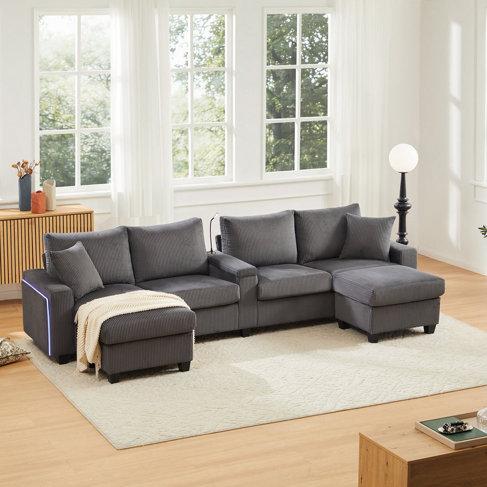 Graues Cord Sofa in U-Form mit zwei Hockern und LED-Beleuchtung